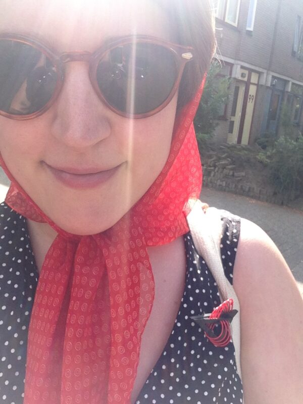red scarf and matching brooch