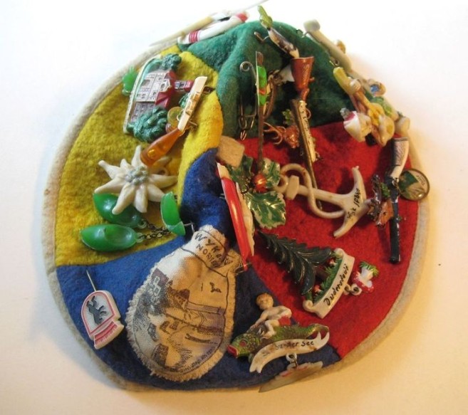 tourist hat filled with vintage broches